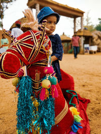 Portrait of woman with multi colored umbrella