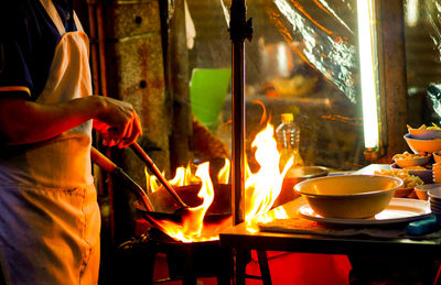 Midsection of man preparing food