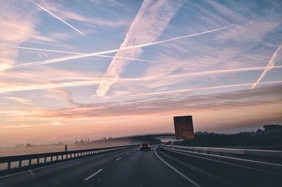 Highway against sky during sunset