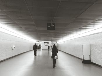 People walking in subway tunnel