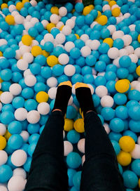Low section of multi colored ball in swimming pool