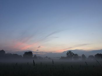 Scenic view of landscape against sky during sunset