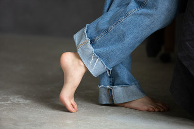 Low section of woman standing on floor