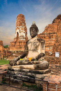 Statue of temple against building