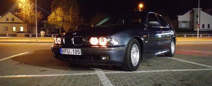 Car parked on city street at night