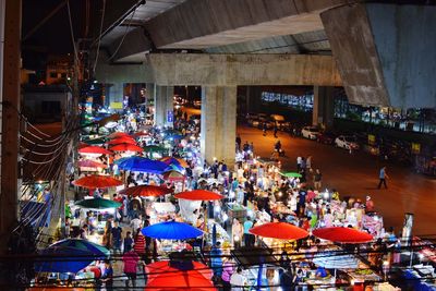 High angle view of market in city at night