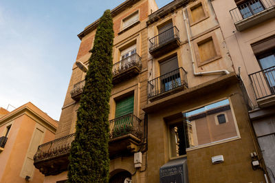 Low angle view of residential building against sky