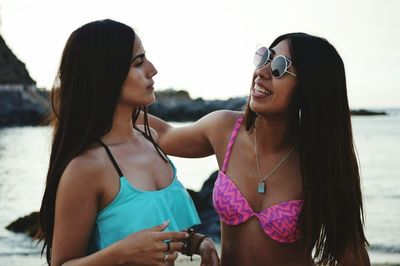 Young woman wearing sunglasses on beach