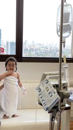 Cute girl standing in hospital