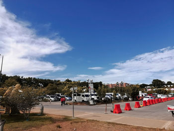 View of city street against blue sky