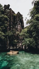 Scenic view of rock formations in water