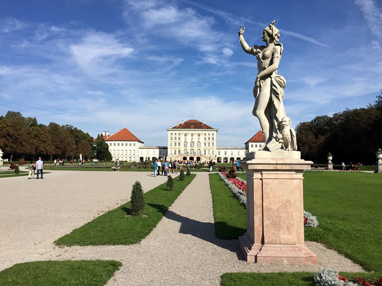 sky, sculpture, architecture, statue, art and craft, human representation, representation, nature, sunlight, built structure, cloud - sky, plant, day, creativity, the past, male likeness, building exterior, history, incidental people, grass, outdoors