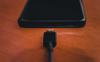 High angle view of smart phone on table