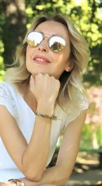 Portrait of young woman wearing sunglasses