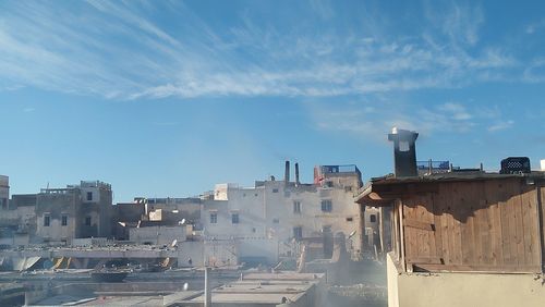 Buildings in city against sky