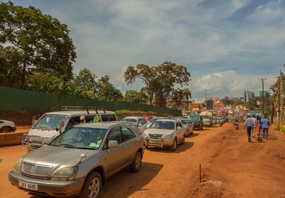 Cars on road against sky