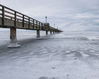 Pier over sea against sky