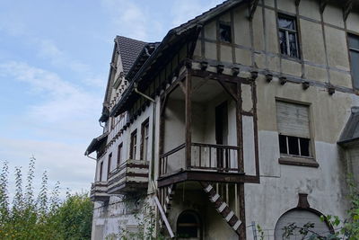 Low angle view of old building against sky