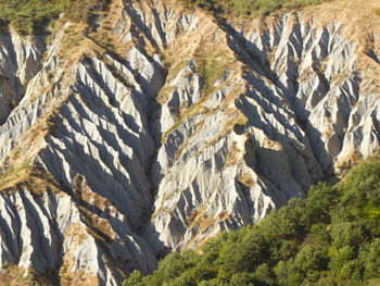 Scenic view of eroded mountain slopes 