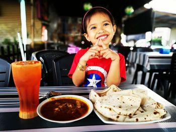 Portrait of a smiling girl in restaurant