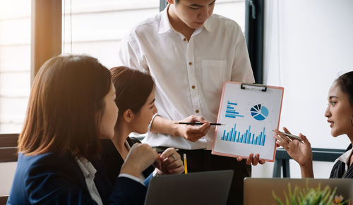 Business colleagues working at office