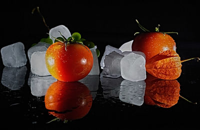 Close-up of fruits against black background