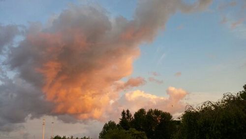 Low angle view of cloudy sky at sunset