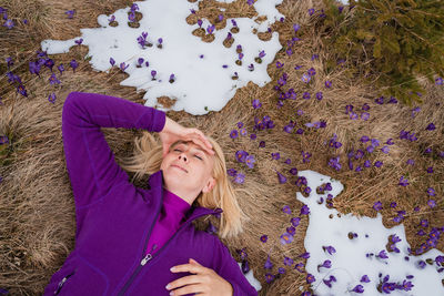 High angle view of young woman standing by plants