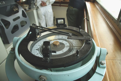 Close-up of navigational compass in ship