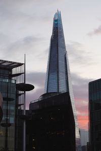 Low angle view of buildings against sky during sunset