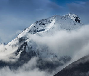 Snow covered mountain against sky