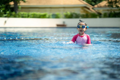 Boy swimming in pool