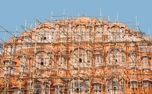 Low angle view of building against clear blue sky