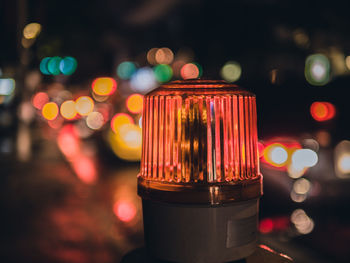 Close-up of emergency light at night