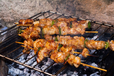 Close-up of meat on barbecue grill