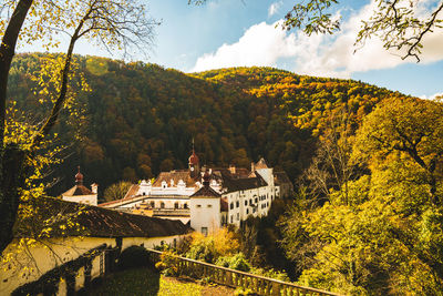 High angle view of trees and houses against sky