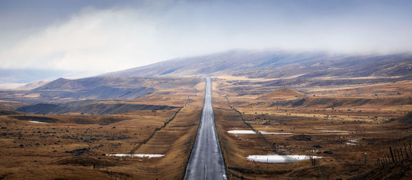 Aerial view of road on landscape against sky