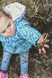 High angle view of girl playing on land