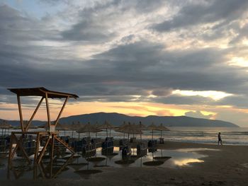Scenic view of beach against sky during sunset