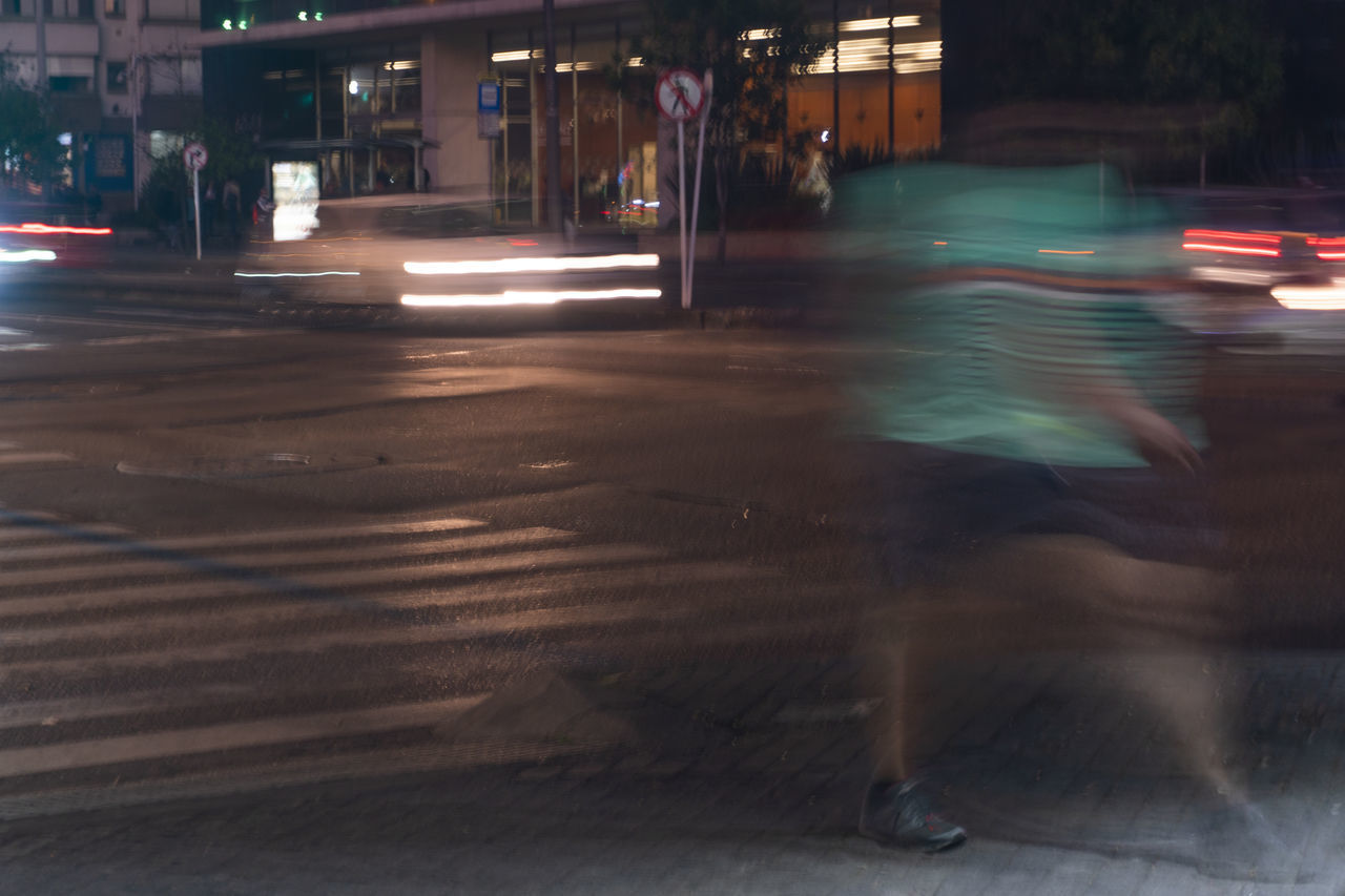 BLURRED MOTION OF CAR ON CITY STREET