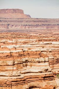 Layers of red and white sandstone canyons of the maze utah