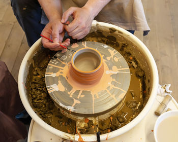 Cropped hand of man working in workshop