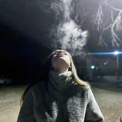 Portrait of woman standing outdoors