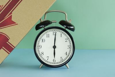 Close-up of clock on table