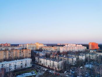 High angle view of townscape against clear blue sky