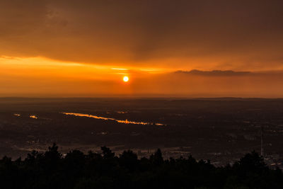 Scenic view of silhouette landscape against sky during sunset