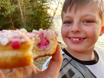 Portrait of boy holding ice cream