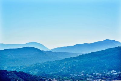 Scenic view of mountains against clear blue sky