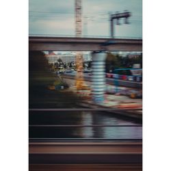 Blurred motion of train at railroad station
