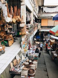 People at market stall in city